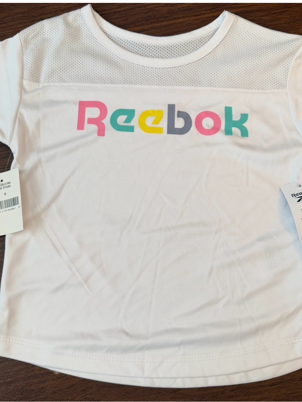 Reebok White Tee with Pink, Teal, Yellow & Gray Logo